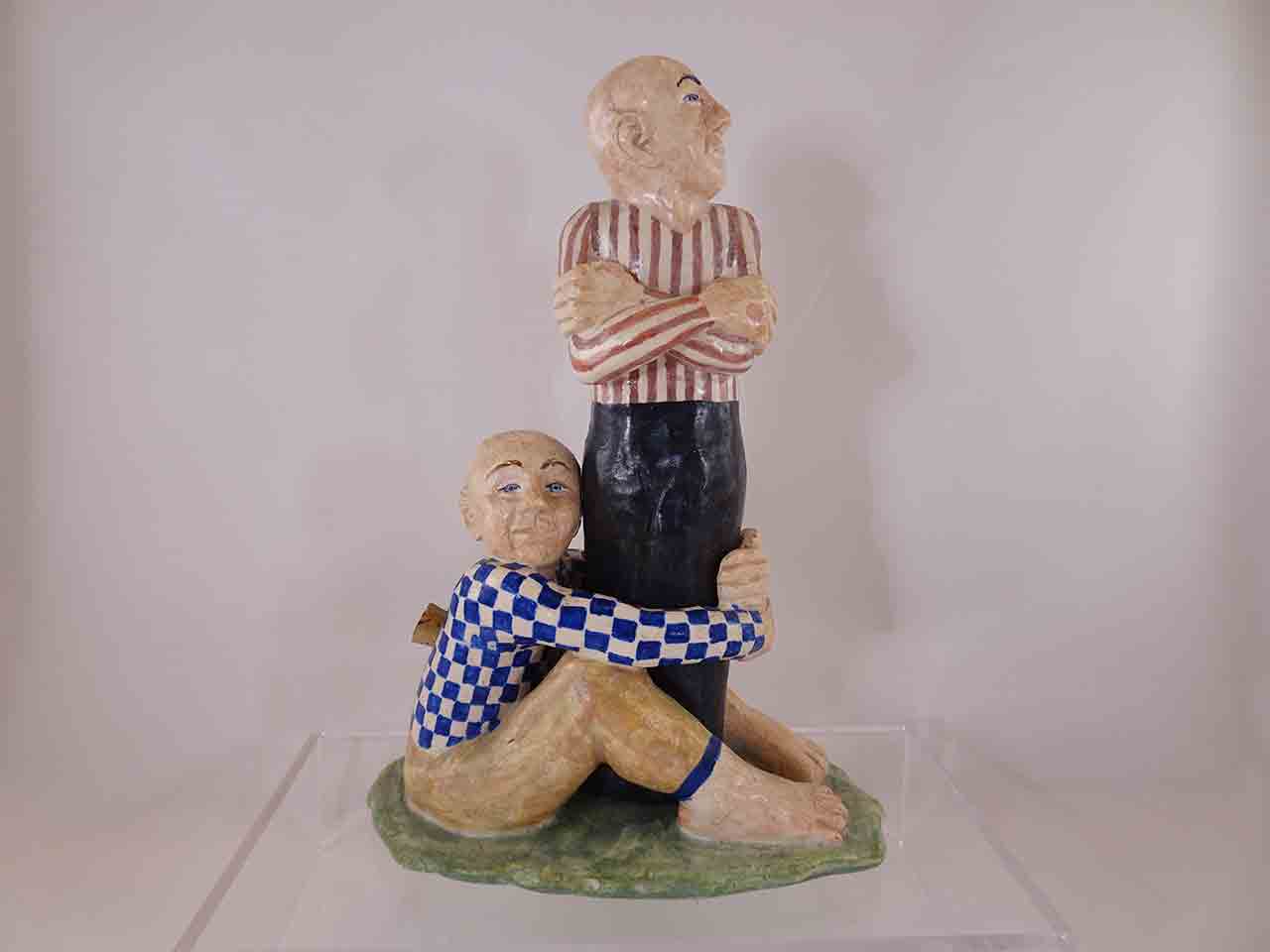 62120 Man holding legs of other man salt and pepper shakers by Marilyn Andrews