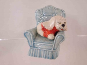 Dog asleep on a sofa chair - stacking salt and pepper shaker