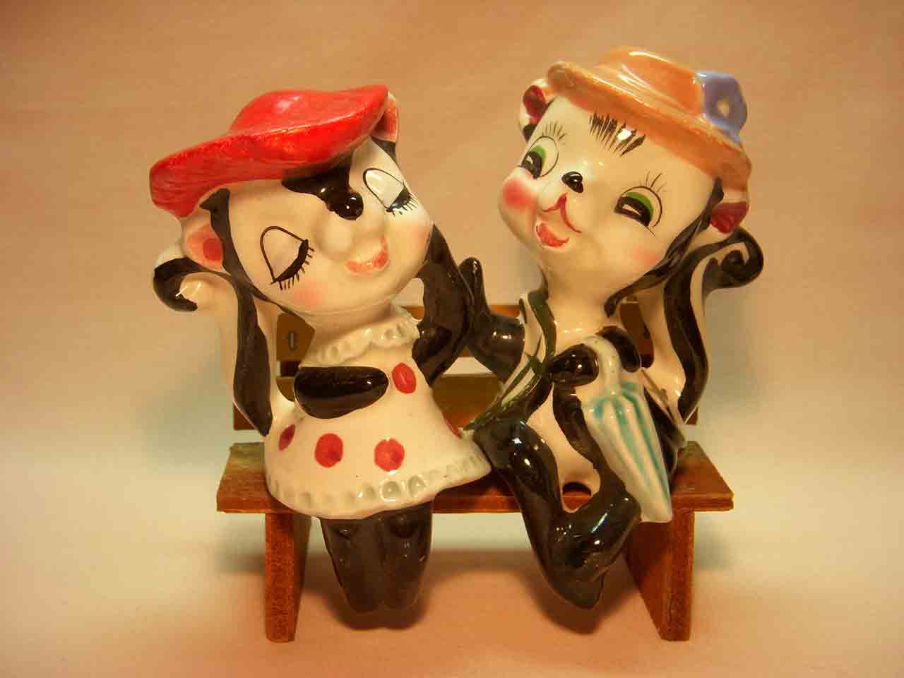 Skunk couple bench sitters salt and pepper shakers